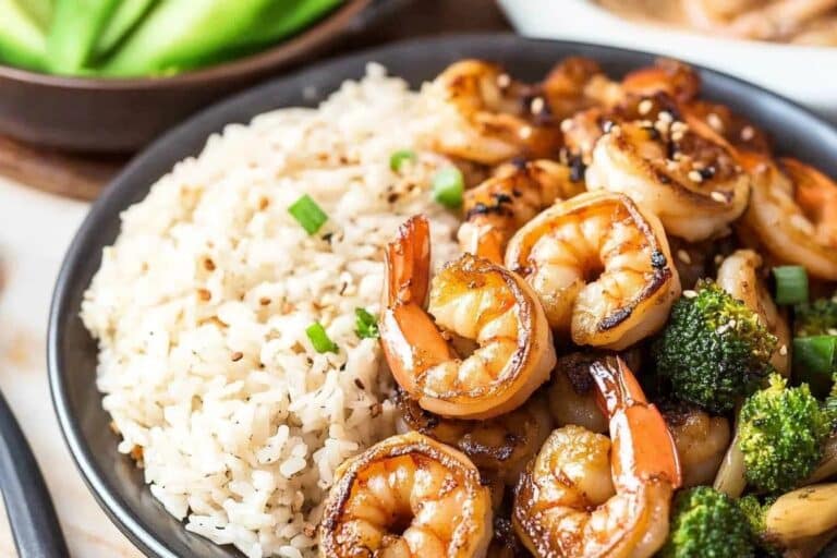 Hibachi shrimp on a plate with hibachi veggies and noodles